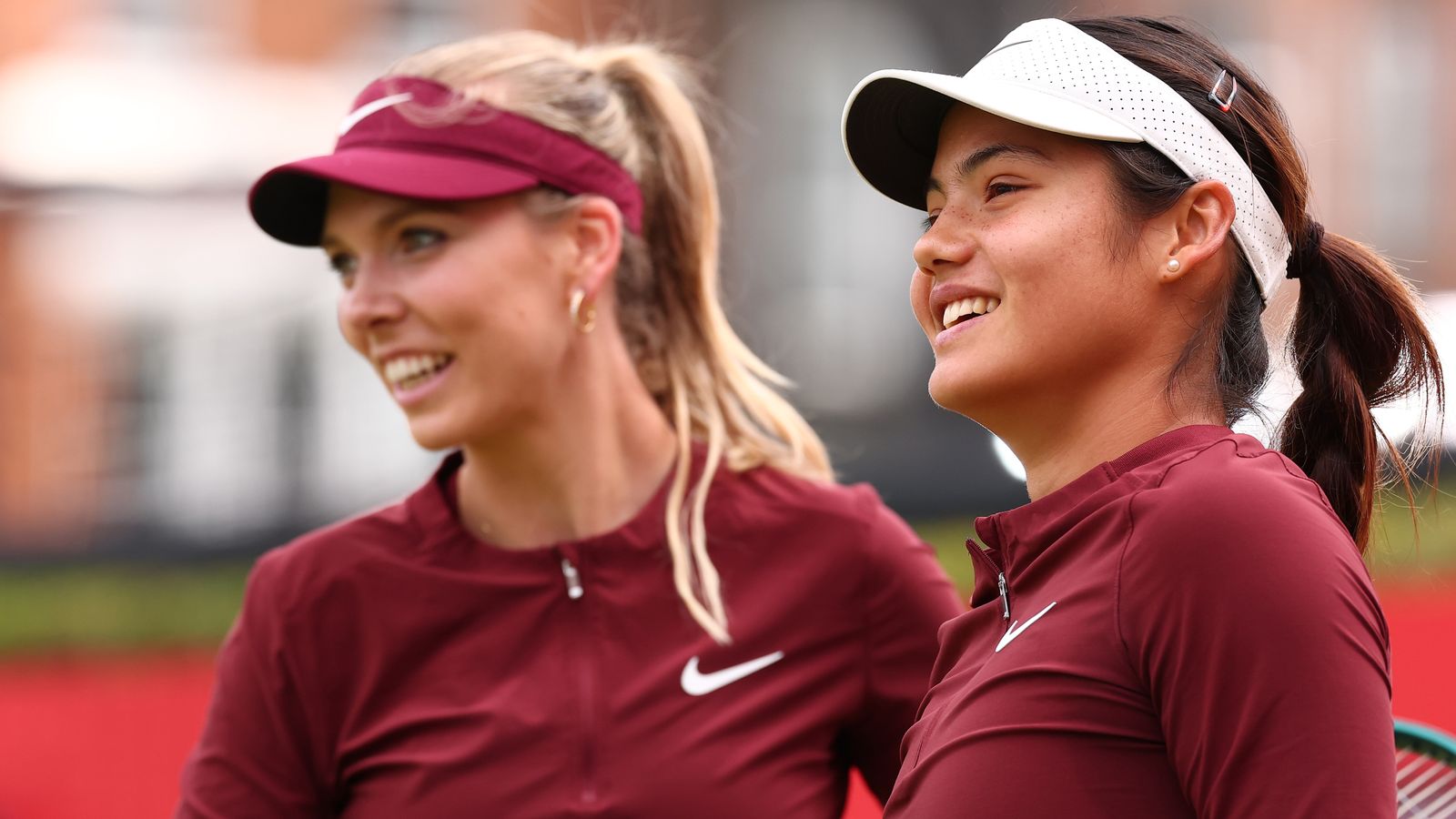 Katie Boulter (GBR) with Emma Raducanu (GBR) during their women's doubles Round 2 match against Lyudmila Kichenok (UKR) and Erin Routliffe